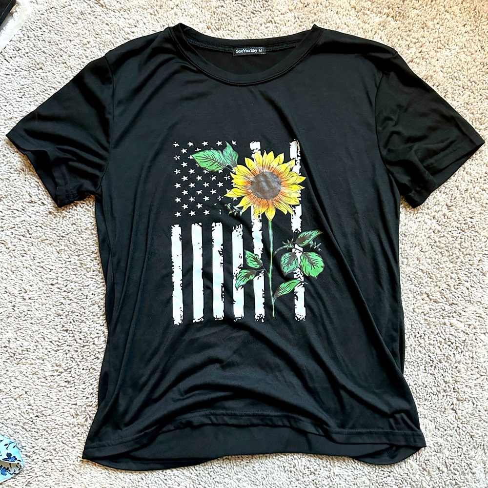 Black t-shirt with american flag and sunflower.